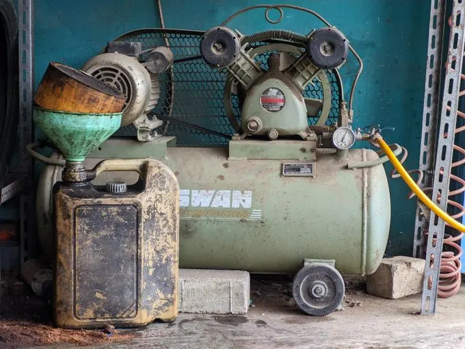 Old industrial air compressor in a workshop
