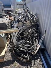 Bundle of scrap cable in a storage bin