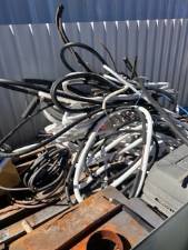 Bin of scrap cable and hose ready for recycling